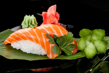 Japanese national popular cuisine. Sushi, rice and fish. Tasty, beautifully served food in a restaurant, cafe, with elements of the original design.