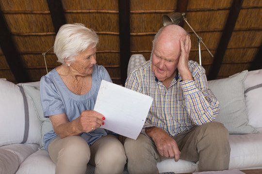 Worried Senior Couple Discussing Over Medical Bills