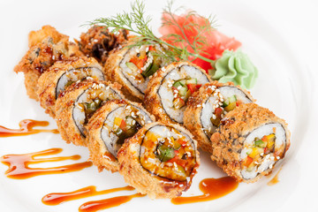 Japanese national popular cuisine. Sushi, rice and fish. Tasty, beautifully served food in a restaurant, cafe, with elements of the original design.