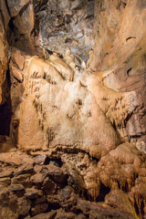 The famous travel destination of Cheddar Gorge caves. Amazing caverns inside the gorge cliffs on an awe scenery. A mysterious and magical place like in a fantasy world at Cheddar Gorge, UK
