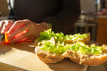 Woman making sandwich rolls