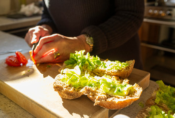 Woman making sandwich rolls