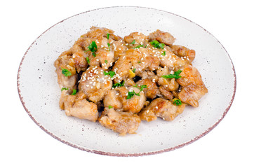 Plate with slices of chicken in batter with sesame seeds