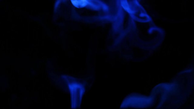 abstract blue smoke mixing on the adges at dark background