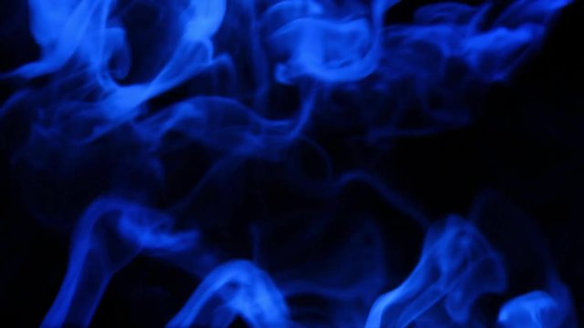 abstract blue smoke mixing on the adges at dark background