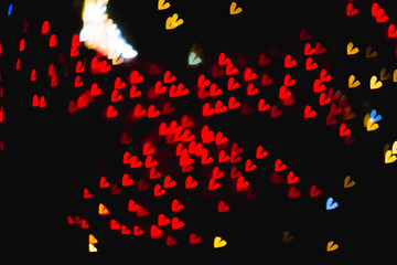 The bokeh of heart shape from the beautiful colourful light decoration at night