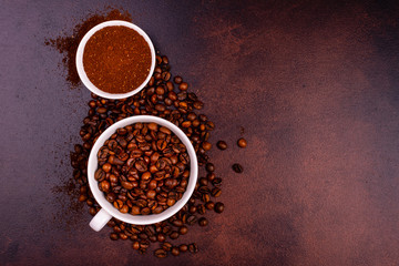 Seeds of fragrant coffee, coffee drink on a dark concrete background. It can be used as a background