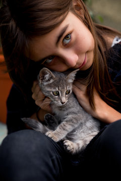 Close Up Of Girl Holding Kitten