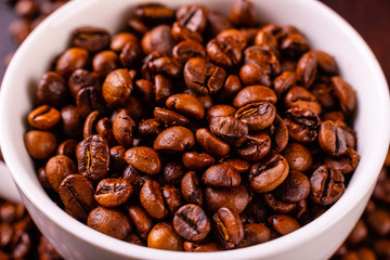 Seeds of fragrant coffee, coffee drink on a dark concrete background. It can be used as a background