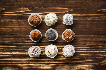 the vegan of handmade candy on a wooden background. Fitness sweets. candies without sugar.