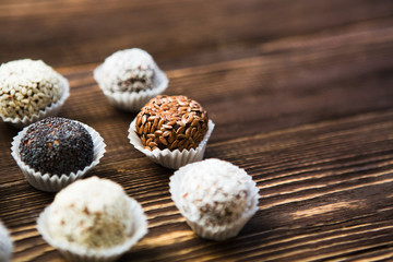 the vegan of handmade candy on a wooden background. Fitness sweets. candies without sugar.