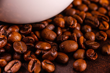 Seeds of fragrant coffee, coffee drink on a dark concrete background. It can be used as a background