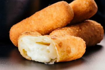 Appetizers called Tequeños made of fried corn filled with cheese