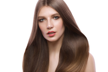 Fototapeta premium Beautiful brown-haired girl with a perfectly smooth hair, and classic make-up. Beauty face.