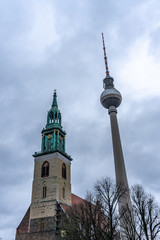 Fototapeta premium View of the tower of the Marienkirche (St. Marys) Church, and TV Tower in Berlin, Germany
