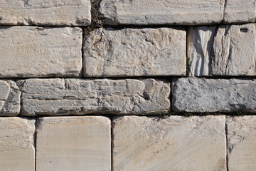 old stone wall of stones background