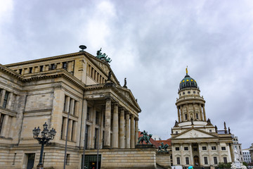 Gendarmenmarkt square with Berlin Concert Hall and French Cathedral in a rainy day, Berlin, Germany