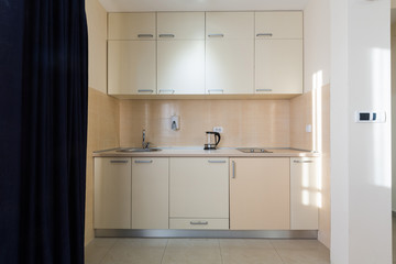 Small kitchen in hotel apartment
