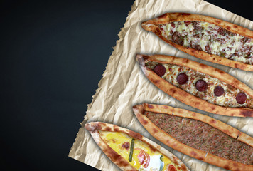 Traditional Turkish pita varieties on black background.