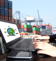 Businesswoman hold tablet or mobile phone working control logistics or import export industry