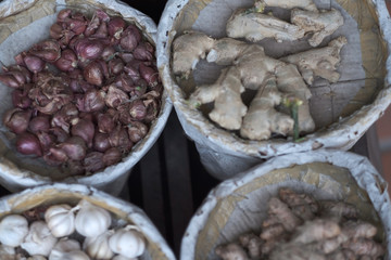 Paper-wrapped buckets with agricultural products in the warehouse of the provincial market. Vietnam