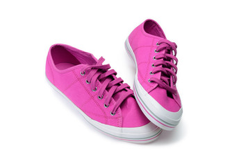 Pair of pink gumshoes. Fuchsia sneakers isolated on a white