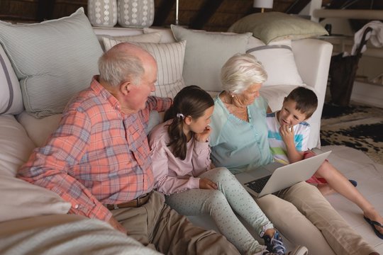 Multi-generation family using laptop 