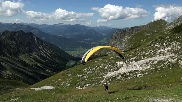Paraglider starting at Hoefatsblick station, Nebelhorn Mountain (2224m), Oberstdorf, Allg?u, Swabia, Bavaria, Germany