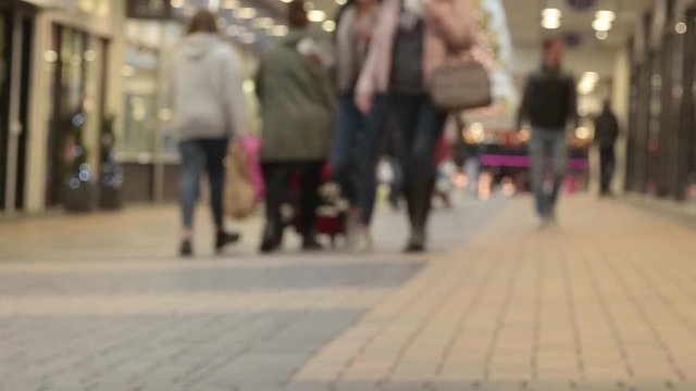 People Christmas Shopping At A Mall