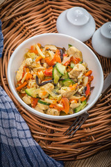 Fried chicken pieces with vegetables.