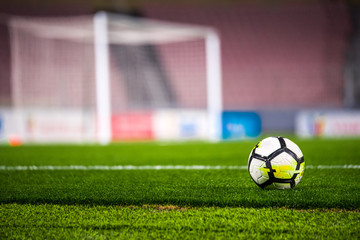 Football concept photo - Ball, stadium, grass and football net