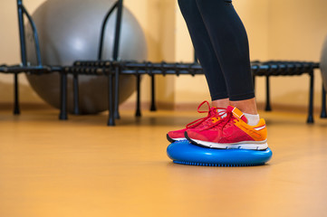 Legs of a girl involved in sports in gym