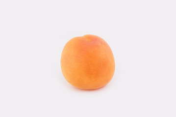 One apricot isolated on white background. Close-up photo