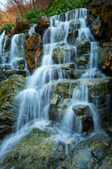 Fototapeta na wymiar Small waterfall cascade
