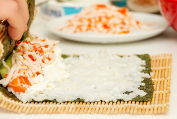 the finished roll lies on a curling mat