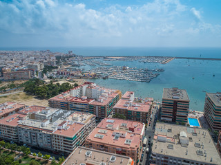 Obraz na płótnie Canvas Aerial photo of harbour, residential houses, highways and Mediterranean Sea of Torrevieja. High angle view famous popular travel destinations for travellers. Costa Blanca. Alicante province. Spain 10