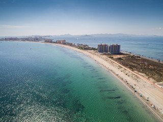 Aerial photo of tall buildings and the beach on a natural spit of La Manga between the Mediterranean and the Mar Menor, Cartagena, Costa Blanca, Spain 10