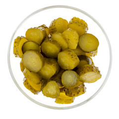 Bowl of chopped pickled cucumber isolated on white background