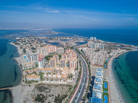 Aerial photo of tall buildings and the beach on a natural spit of La Manga between the Mediterranean and the Mar Menor, Cartagena, Costa Blanca, Spain 12
