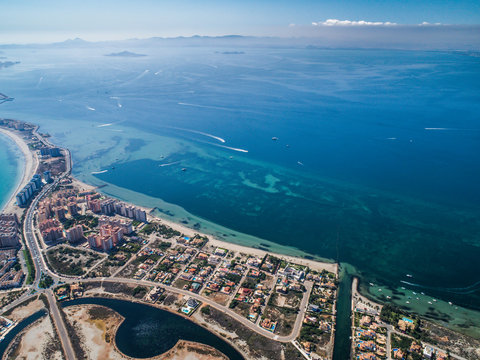 Aerial photo of buildings, villas and the beach on a natural spit of La Manga between the Mediterranean and the Mar Menor, Cartagena, Costa Blanca, Spain 9