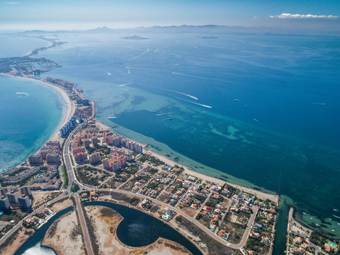 Aerial photo of buildings, villas and the beach on a natural spit of La Manga between the Mediterranean and the Mar Menor, Cartagena, Costa Blanca, Spain 10