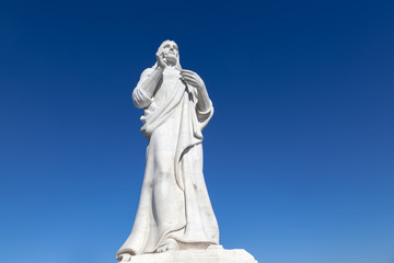 statue of Jesus Christ in Havana on background blue sky, Cuba