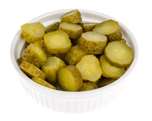 Bowl of chopped pickled cucumber isolated on white background
