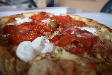 Delicious Italian fast food. Close up of pizza with cheese, cream, tomato sauce, oregano