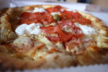 Delicious Italian fast food. Close up of pizza with cheese, cream, tomato sauce, oregano