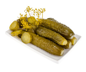 Bowl of chopped pickled cucumber isolated on white background