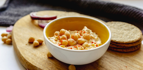Oatcakes and hummus photographed from above.