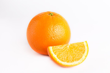 Plakat Fresh juicy orange and one lobule isolated on white background. Close photo. View from above