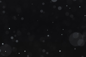 Snow bokeh on black background