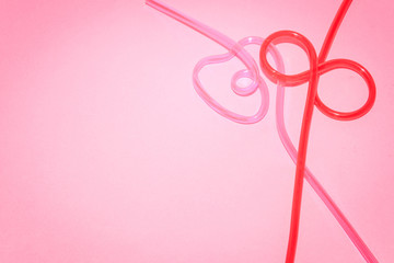 Tubules for cocktails on a pink background. Drinkers.